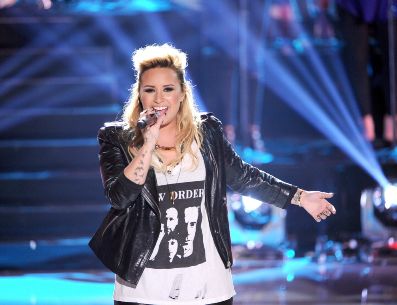 Demi participó en la serie de “Barney y sus amigos” cuando tenía 9 años con el personaje de Ángela. AFP/KEVIN WINTER